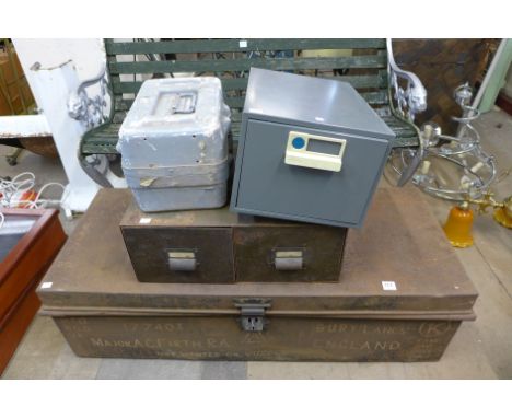 A metal trunk/tool chest and three metal boxes
