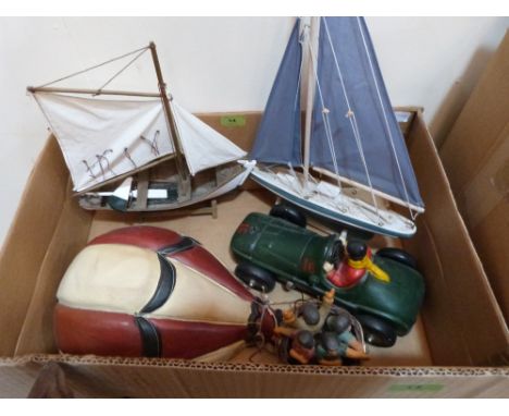 Two model yachts, balloon and racing car