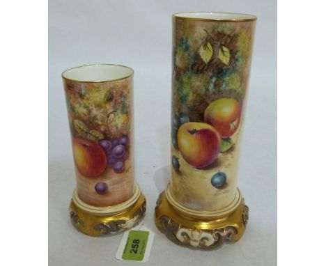 A pair of Royal Worcester graduated cylindrical vases, finely painted with fruit on a mossy bank, no 6/161/3 and 6/161/4. Bot