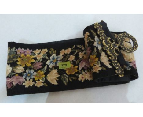 A tapestry and brass mounted bell pull. 53' long