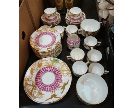 A Victorian part tea service by Edwin J. Bodley (Hill Pottery) of 43 pieces, painted with radiating pink foliage and gilded w