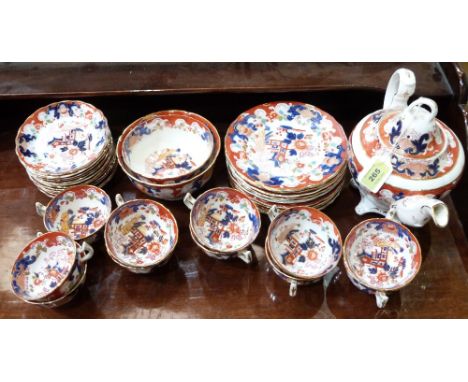 A Victorian part tea service of 37 pieces decorated in chinoiserie style. Red crown mark