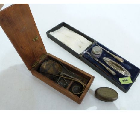 A miners brass tobacco box, a cased silver manicure set and a boxed set of scales