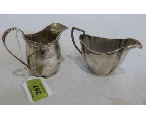 A George V silver helmet cream jug. Birmingham 1919. 2ozs; together with a plated cream jug