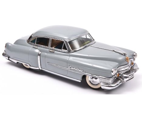 An impressive Japanese Tinplate Marusan Toys Kosuge (SAN) 1953 Cadillac Fleetwood Saloon. A friction powered example with ste