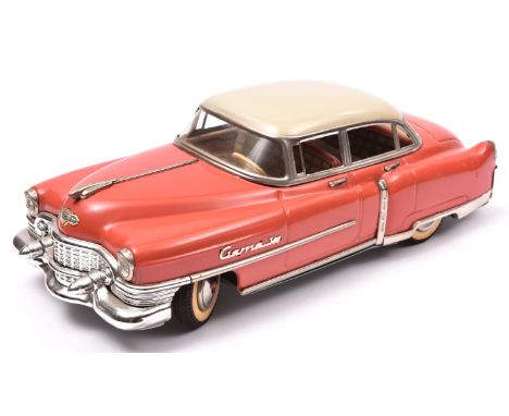 An impressive GAMA Tinplate 1950's American Saloon. A friction powered example with steering, finished in orange with cream r