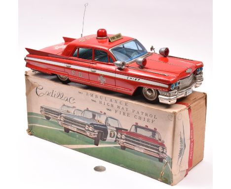 An Impressively Large Japanese Bandai Tinplate Friction Powered Fire Chief Car. Very loosely based on a 1961-62 Cadillac 4 do