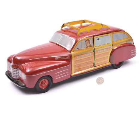 A rare and Impressively Large American Produced By Wyandotte Toys Pressed Tinplate 1940's 'Woody' Station Wagon. A push along