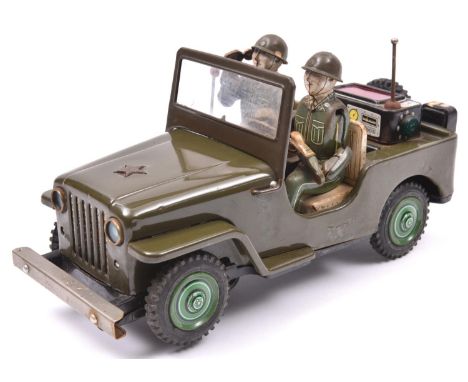 A 1960's Japanese T.N. (Nomura Toys) U.S. Army Jeep. A battery powered example with 'mystery action', painted in olive green,