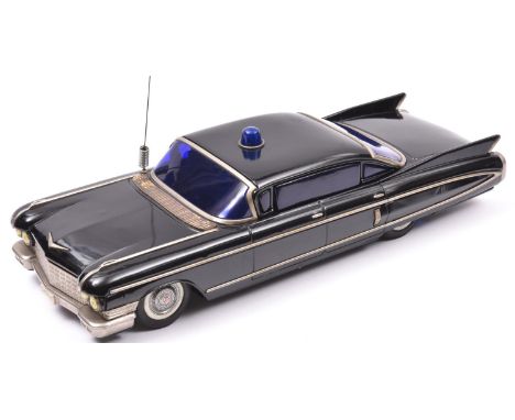 An impressively Large Yone (Y) Tinplate Battery Powered 1960 Cadillac Coupe DeVille. Finished in gloss black as a POLICE vehi