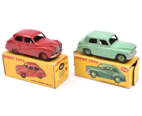 2 Dinky Toys. An Austin Somerset (161). An example in red with red wheels and black tyres. Plus a Hillman Minx Saloon (154). 