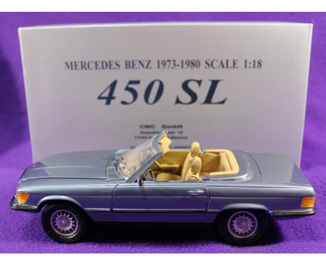 A CMC 1:18 scale Mercedes-Benz 450SL. A top down example in light metallic blue with fawn interior. Boxed. Vehicle Mint, £80-