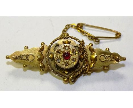 A Victorian 9ct gold ruby and diamond brooch, stamped 375, 3.5g 