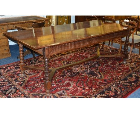A large rosewood refectory table, with plank top, raised on bobbin style columns and beam under stretchers, 76cm high x 229cm