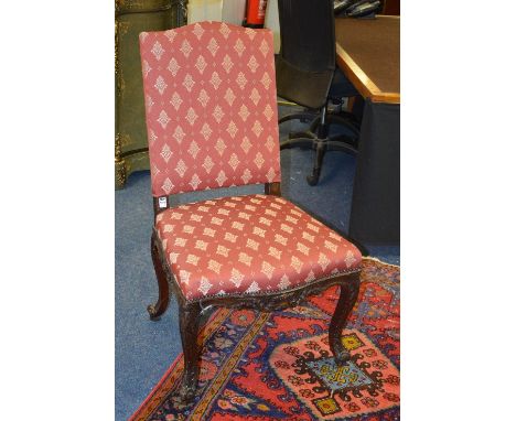 A Chippendale style mahogany chair, upholstered in later red fabric, raised on scroll supports, 100cm high