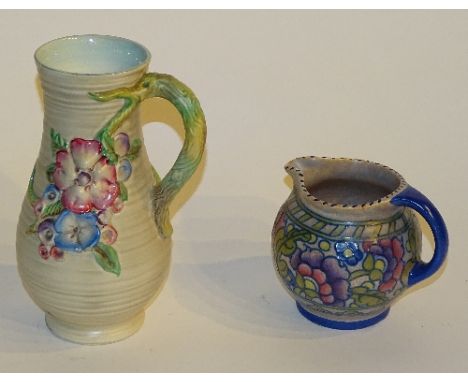 A Crown Ducal Charlotte Rhead jug circa 1930s, decorated in purple, pink and green floral motifs on beige ground, marked 'Rhe