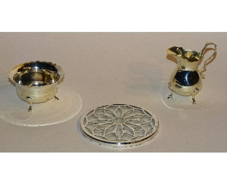 A silver cream jug, hallmarks for Birmingham 1903 CH, of plain design raised on tripod supports with hoof feet, 9.5cm high, t