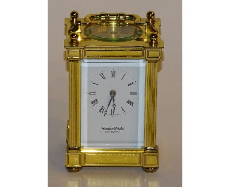 A Hamilton & Inches brass cased carriage clock, in fitted box, with Matthew Norman, Switzerland movement, with key, 12cm high