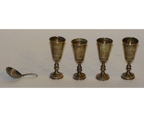 A set of four silver liqueur cups, hallmarks for Chester 1919 JZ, with engine turned decoration, 8cm high, together with a Ge