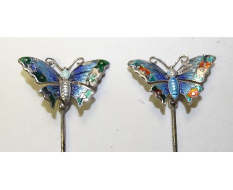 A pair of silver Charles Horner butterfly hat pins, hallmarks for Chester 1910 CH, the butterflies of different coloured enam