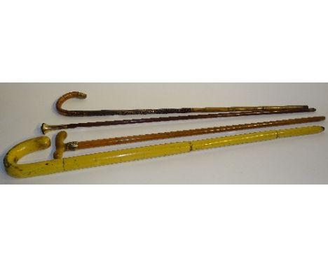 Three walking sticks circa late 19th century, with gold coloured mounts and collars, one with horn handle, 90, 91 & 96cm long