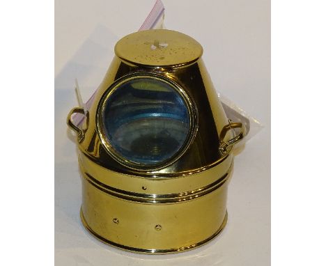 A brass ships compass, on gimble support within brass, glazed casing, (interior light fitting present but not fitted), 19cm h