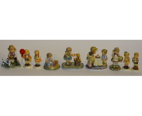Nine Goebel Hummel figures, to include larger figurines 'Bowl of Love', 'Tea Party', 'With Love', 'Sealed with a Kiss' & 'Wis