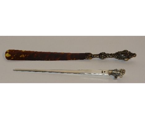 A silver letter opener with lion finial, hallmarks for Sheffield 1926 RR, 18.5cm long, 1ozt, together with a silver handled t