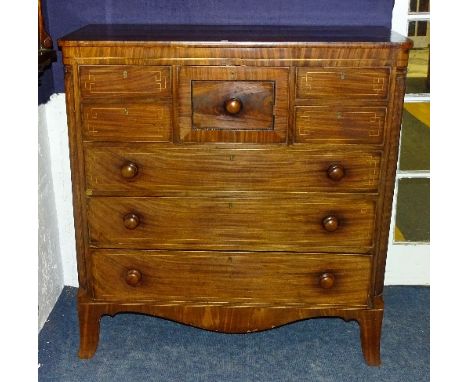 A George IV mahogany chest of drawers, with large drawer flanked with two small drawers above three long graduated drawers, r