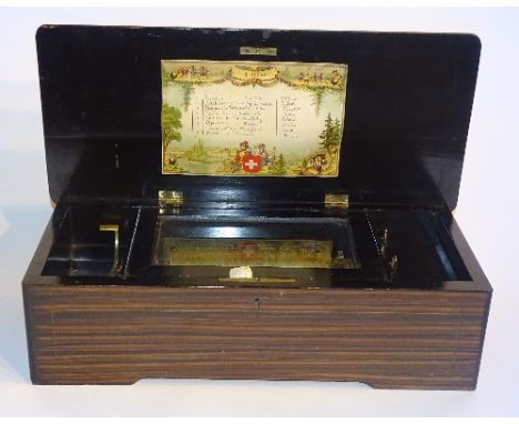 A Swiss inlaid rosewood cased music box circa late 19th century, with crank lever, start lever, cylinder and comb in good con
