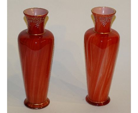 A pair of late 19th century Loetz orange and red mottled glass vases circa 1890, of shouldered form with floral enamel bandin