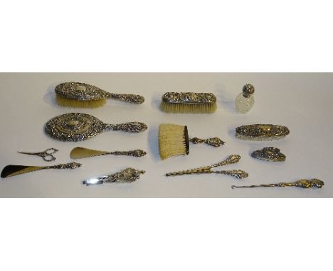 A collection of near matching silver dressing table items, hallmarks for Birmingham, Chester and London circa late 19th/early