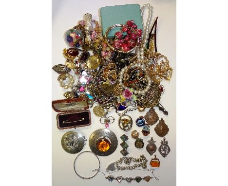 A quantity of silver and costume jewellery, to include a silver padlock bracelet, white metal Scottish brooches, silver and m