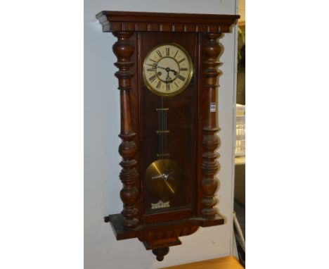 A mahogany cased Vienna wall clock by Gustav Becker circa early 20th century, with glazed door enclosing cream enamel dial wi