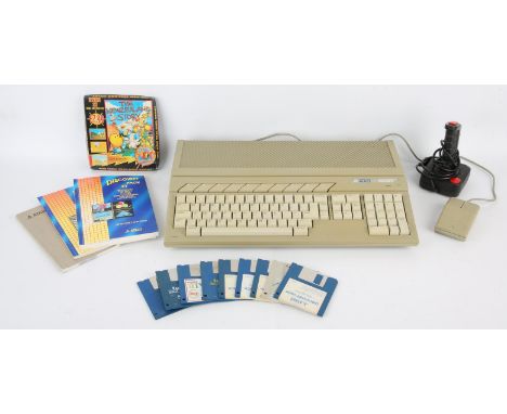 Atari ST personal computer with a boxed copy of The New Zealand Story and a selection of loose disks and accessories Accessor