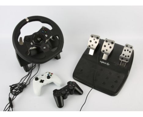 A large assortment of controllers, cables and peripherals for Xbox and PlayStation consoles Highlights include: LOGITECH Driv