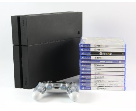 PlayStation 4 (PS4) black console with a clear Dualshock 4 controller (x1) and 12 EA-published games Games include: FIFA 14, 