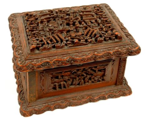 AN INDIAN CARVED SANDALWOOD TRINKET BOX LINED IN MAROON VELVET, 19CM L, 19TH C