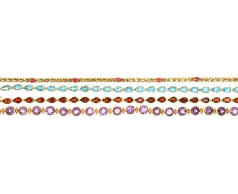 FOUR GEM SET BRACELETS IN 9CT GOLD, COMPRISING A RUBY BRACELET, A GARNET BRACELET, A TOPAZ BRACELET AND AN AMETHYST BRACELET,