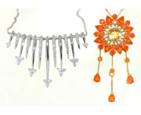 A FIRE OPAL PENDANT IN GOLD MARKED 9K, ON GOLD CHAIN MARKED 375, AND A DIAMOND PENDANT IN WHITE GOLD MARKED 9K, ON 9CT WHITE 