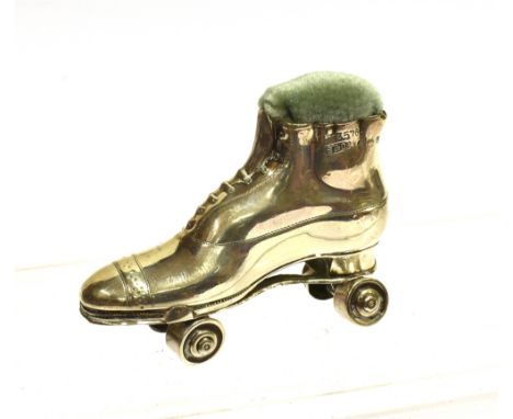 A SILVER ROLLER SKATE PIN CUSHION  Hallmarked Birmingham 1909, maker Sydney &amp; Co, 7cm long. Condition Report : Condition: