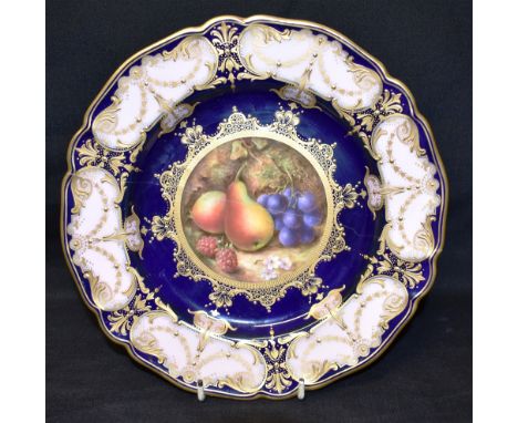 A ROYAL WORCESTER CABINET PLATE  the centre painted with fruit, signed 'Sebright', on a Royal blue ground, with gilt highligh