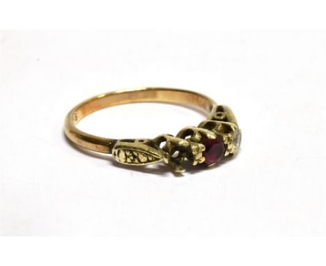 A RED AND WHITE THREE STONE 9CT GOLD DRESS RING small red central synthetic ruby, one white stone missing, ring size L, gross