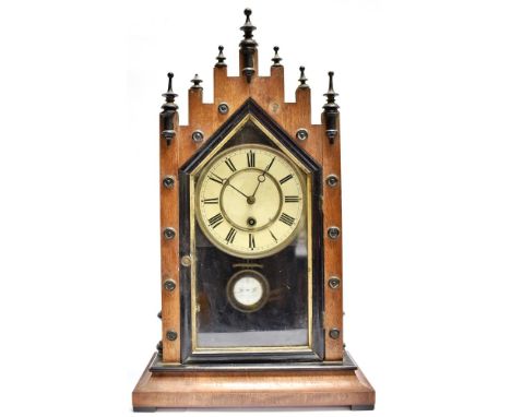 AN AMERICAN MANTLE CLOCK  the 6' dial with Roman numerals, 29cm x 49cm overall