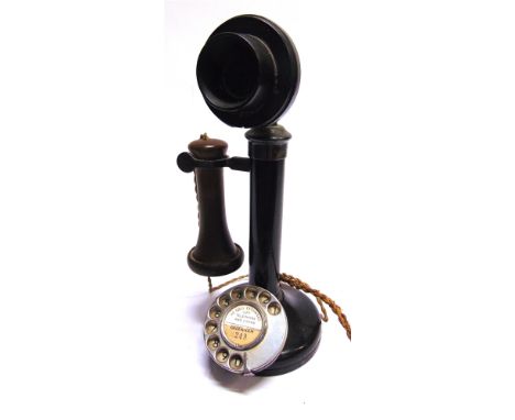 A RING-DIAL CANDLESTICK TELEPHONE  with a bakelite mouthpiece, overall 30.5cm high, (requires re-wiring).