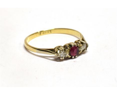 A RUBY AND DIAMOND 18CT GOLD RING small round cut central ruby with a small round brilliant cut diamond each side, ring size 