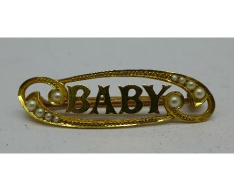 A yellow metal and seed pearl 'Baby' brooch, 2.9g