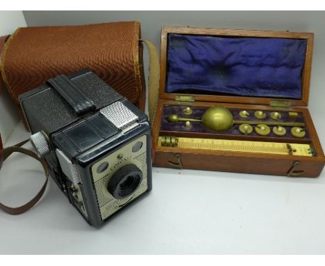 A Sikes Hydrometer, cased, thermometer, missing, and a Coronet Super-Flash camera, with case