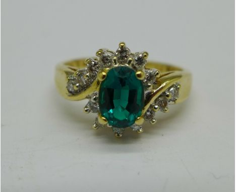 An 18ct gold, green stone and diamond ring, 4g, L