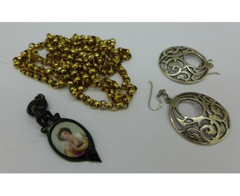 A plated guard chain, a pair of silver earrings and a pendant